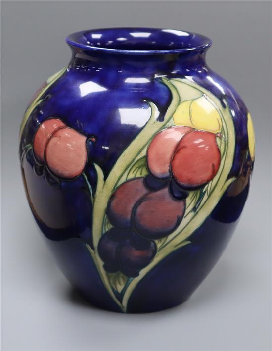 A Moorcroft blue ground Wisteria pattern vase height 22cm